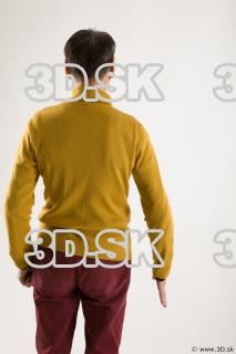 Arm flexing reference of yellow sweater red trousers Sidney 0006